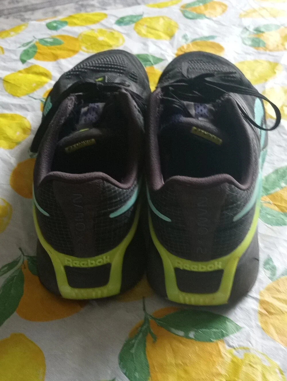 Reebok Black Sneakers with Teal Logo and Yellow Tab